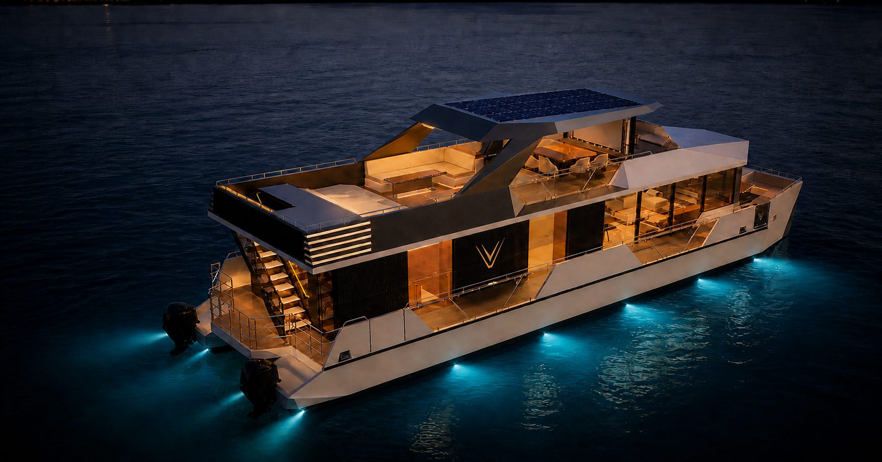 RISE 70 illuminated at anchor at night, viewed from above the stern quarter