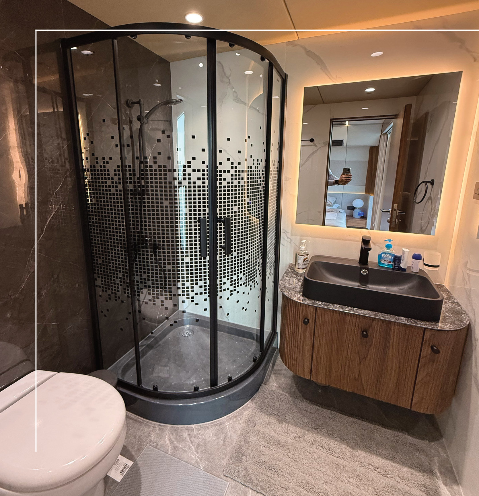 RISE 70 bathroom with glass shower enclosure, stone basin and walnut joinery
